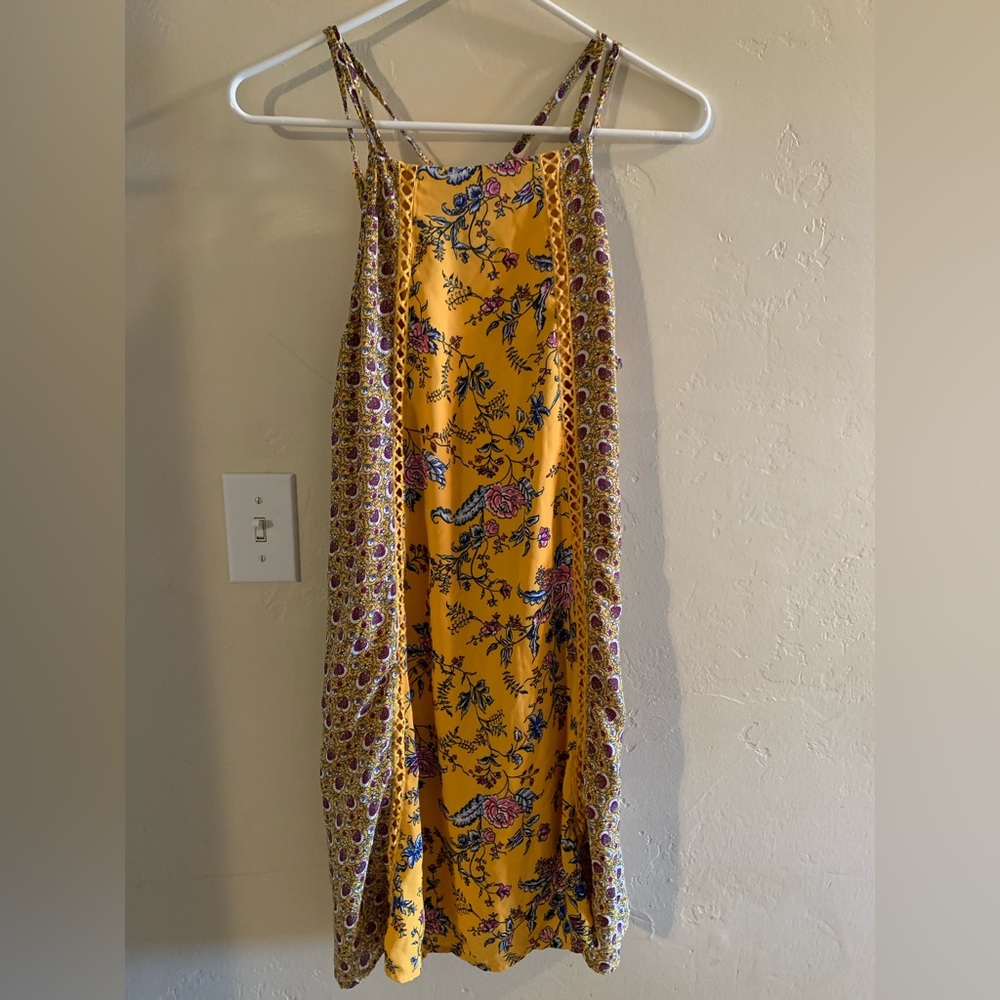 Yellow floral strapped dress.